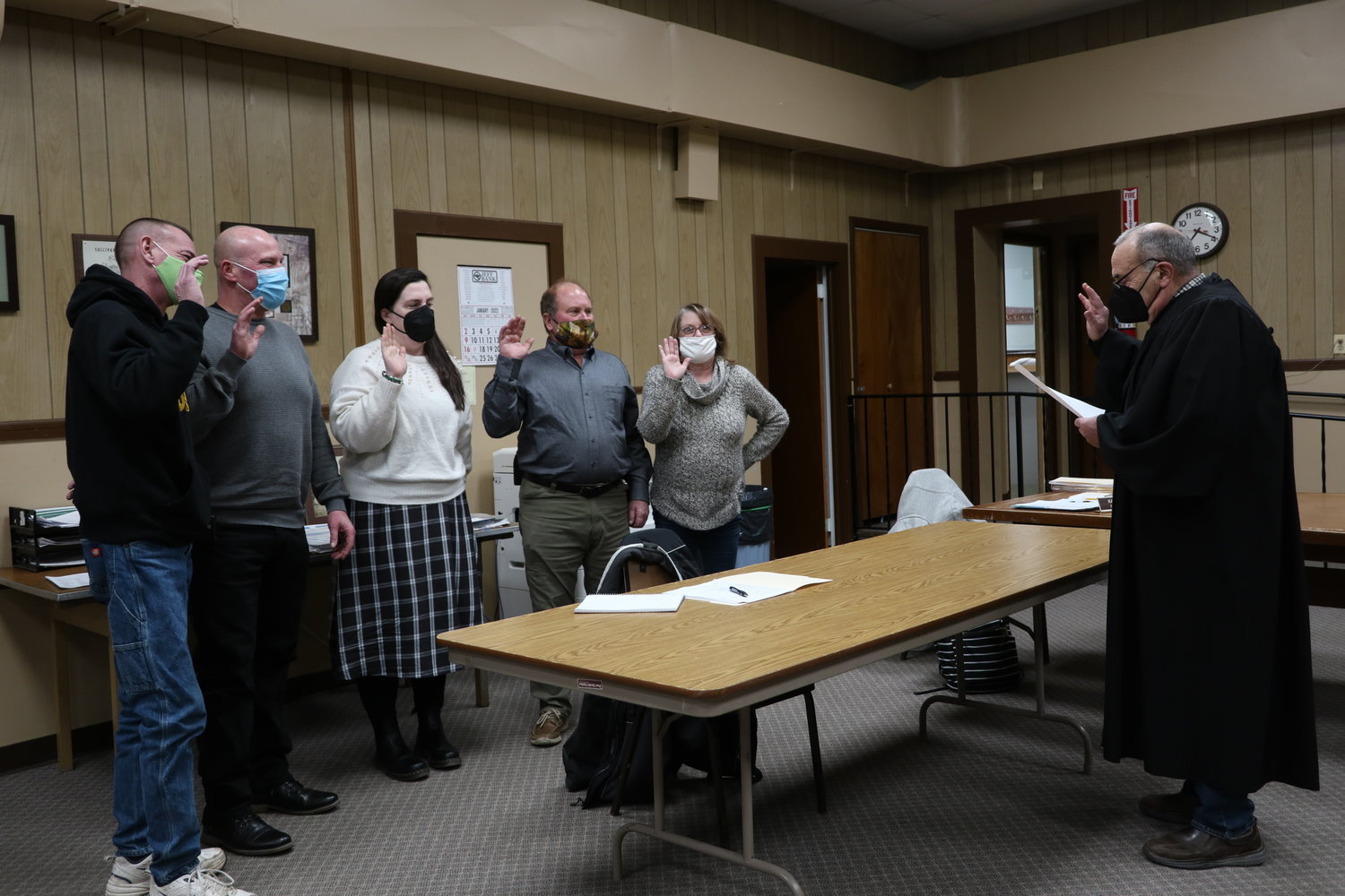 Highland Judge Anthony LaRuffa, right,  delivers the oath of office to highway superintendent Tom Ebers, left, councilmembers Chris Tambini and Kaitlin Haas, supervisor Jeff Haas and town clerk Sue Hoffman at the reorganizational meeting on January 4.
